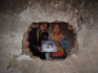 Photographer presents Book to the Cover Image Boy