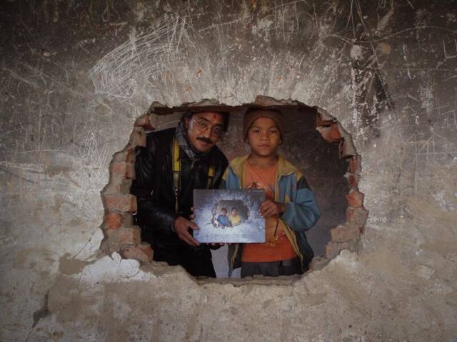 Photographer presents Book to the Cover Image Boy